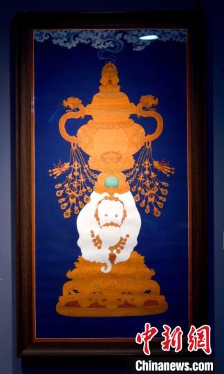 圖為5月16日，展覽中的新創(chuàng)唐卡作品《瑞象承香》?！±盍?攝